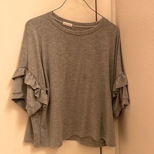 beautiful, light grey, with some ruffles added on the short sleeves for detail.